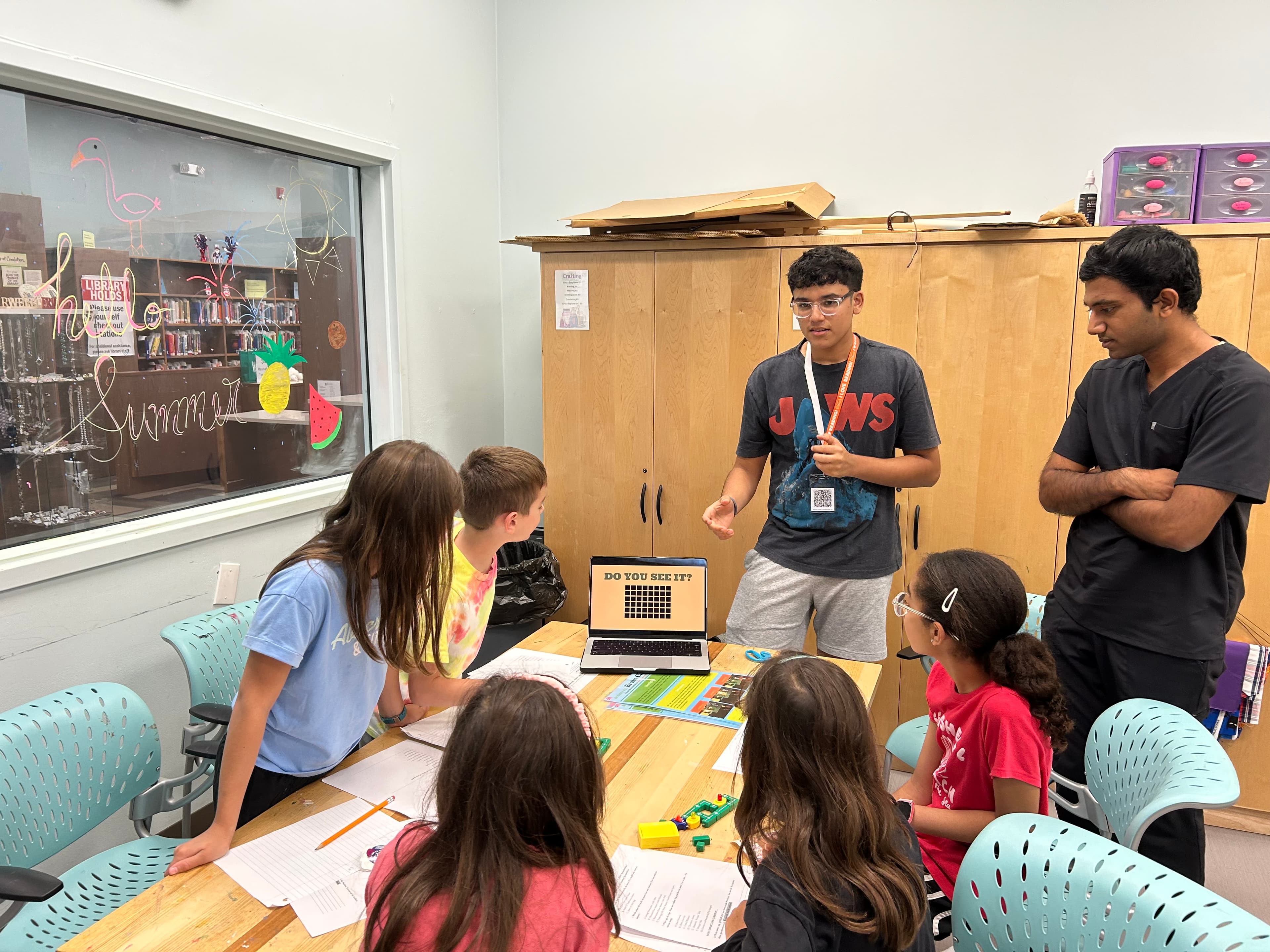 Students and mentors creating together at a workshop