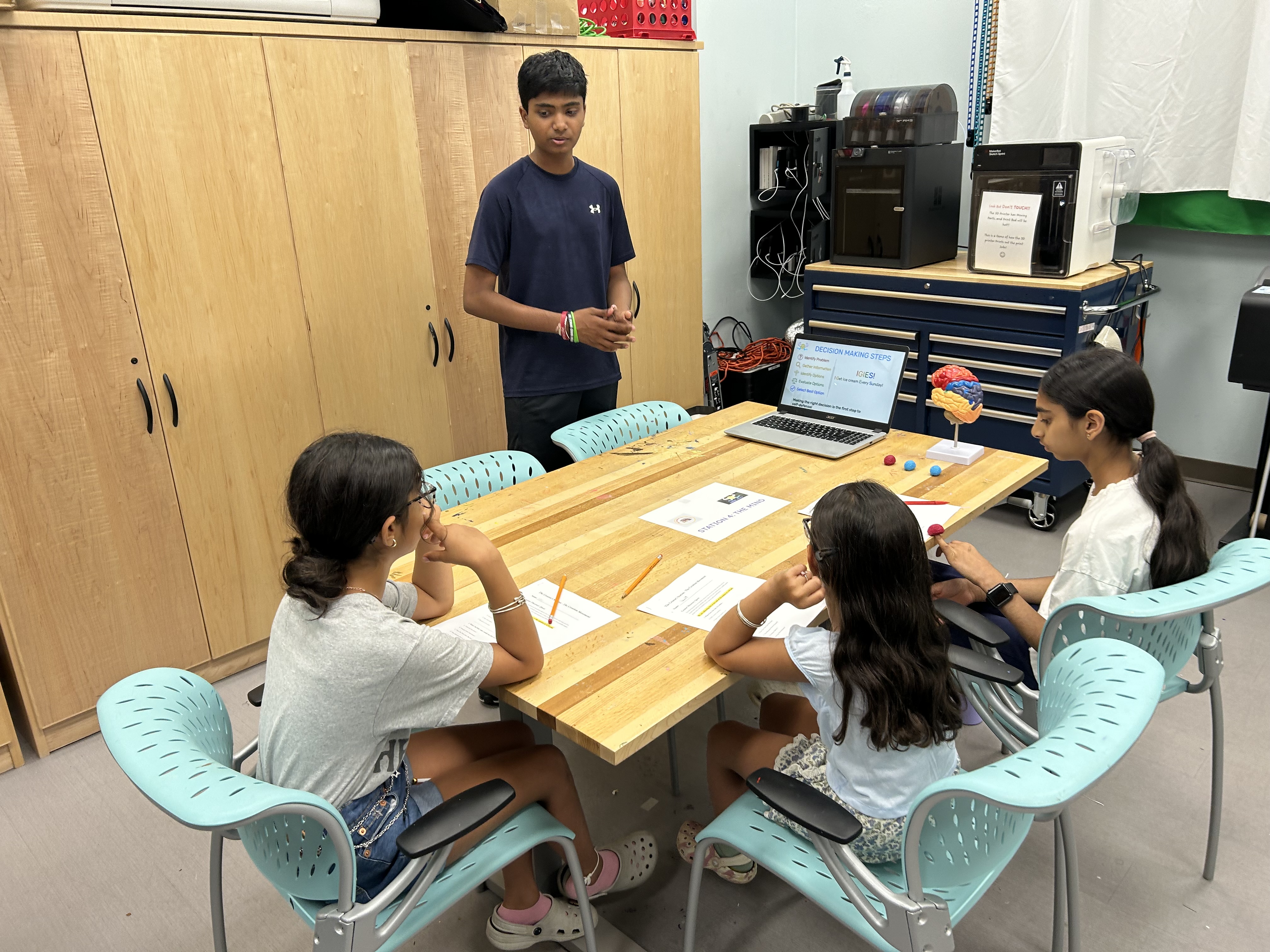 A student presenting an activity during a Creation Movement workshop